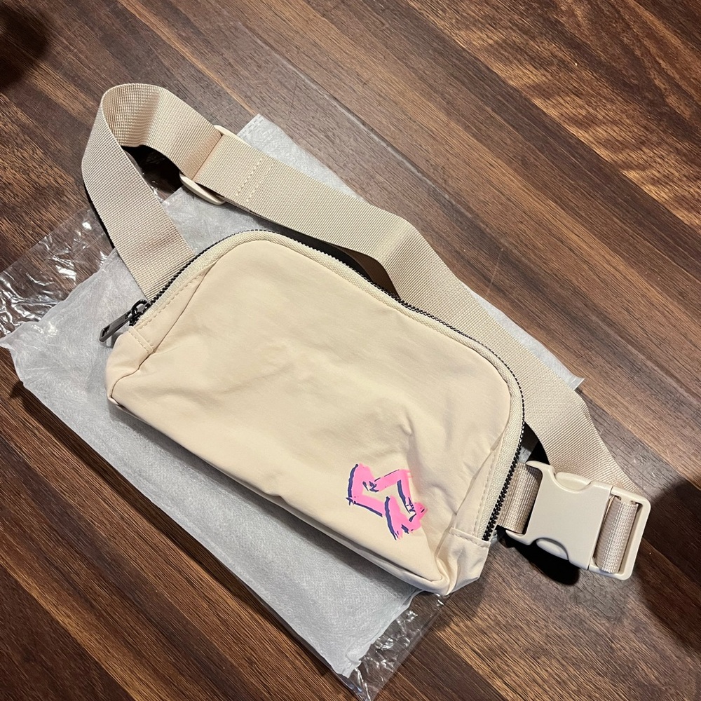 Beige Crossbody Bag with Pink Primal Queen Logo